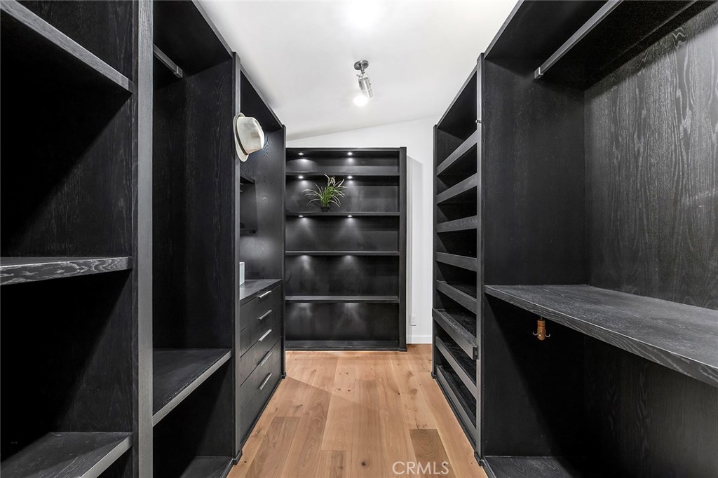 2526 Monaco Drive Laguna Beach, CA 92651 - Photo 27 of 59 a view of walk in closet with clothes and shoes