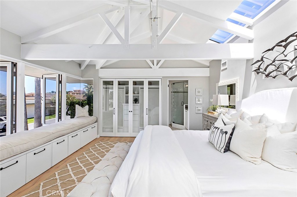 2526 Monaco Drive Laguna Beach, CA 92651 - Photo 28 of 59 a large white room with a large window and chandelier