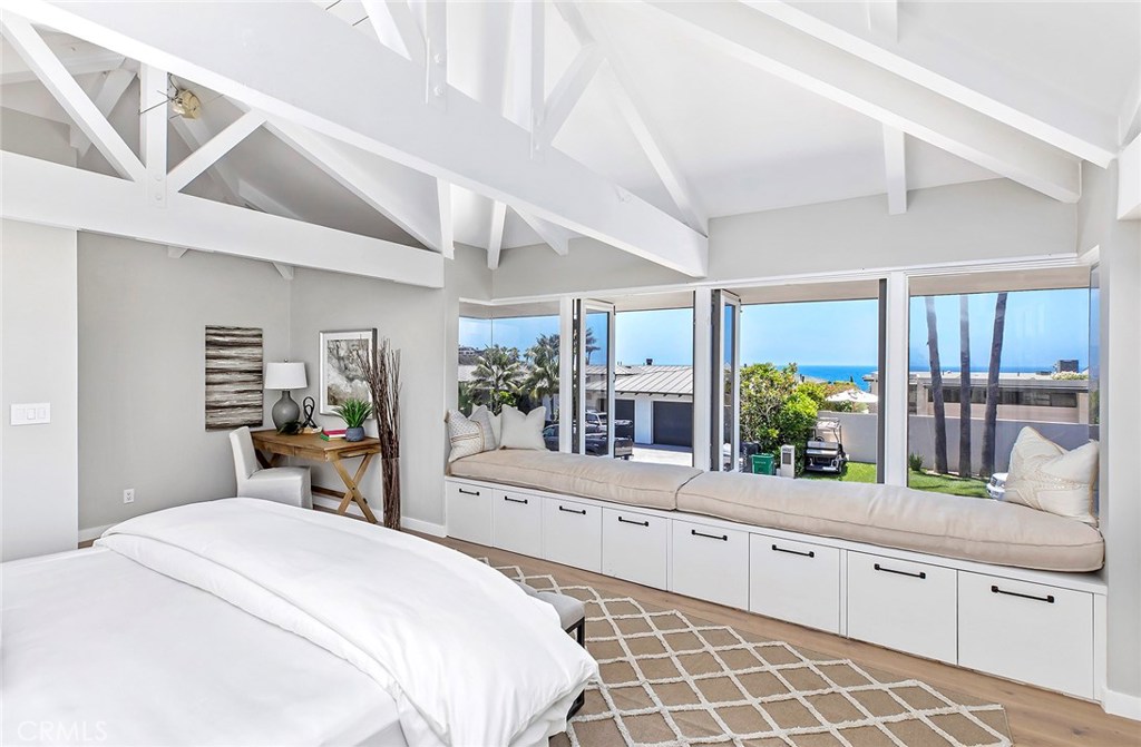 2526 Monaco Drive Laguna Beach, CA 92651 - Photo 29 of 59 a large bedroom with a large bed and windows