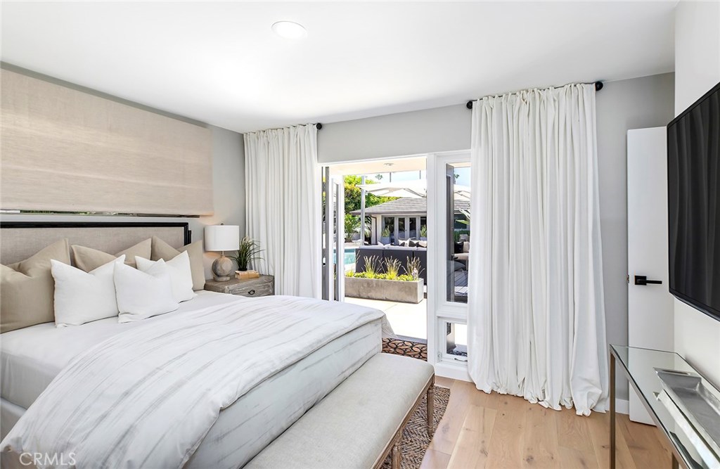 2526 Monaco Drive Laguna Beach, CA 92651 - Photo 31 of 59 a bedroom with a bed and a flat tv screen on dresser