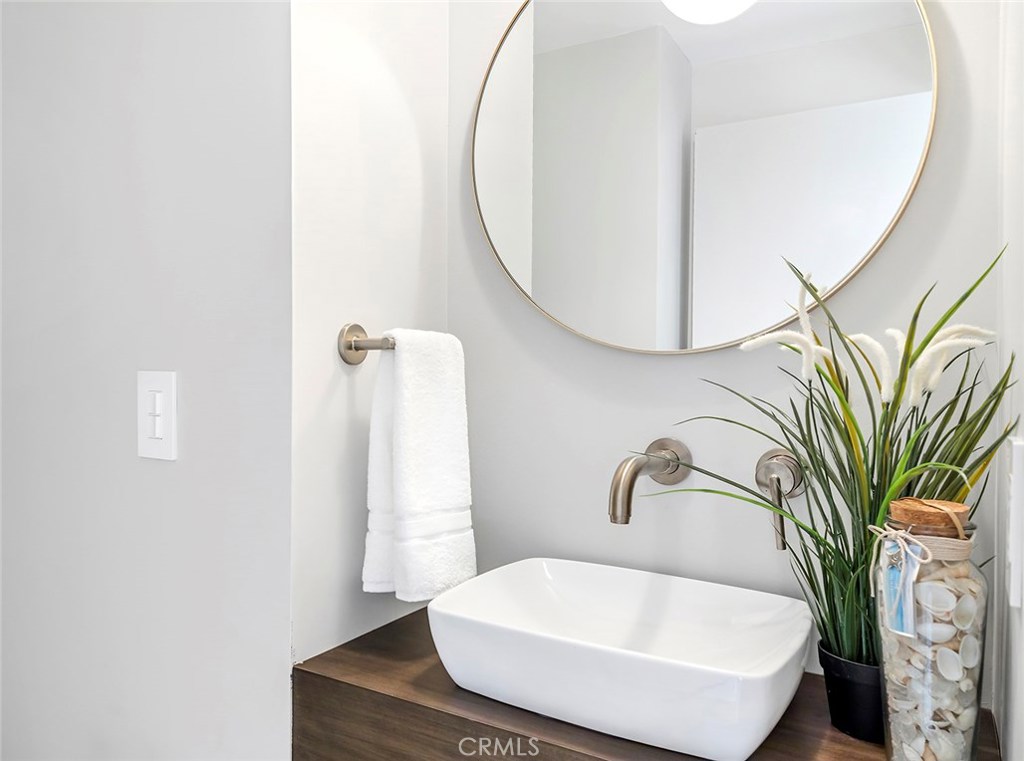 2526 Monaco Drive Laguna Beach, CA 92651 - Photo 33 of 59 a bathroom with a sink a bathtub and a mirror