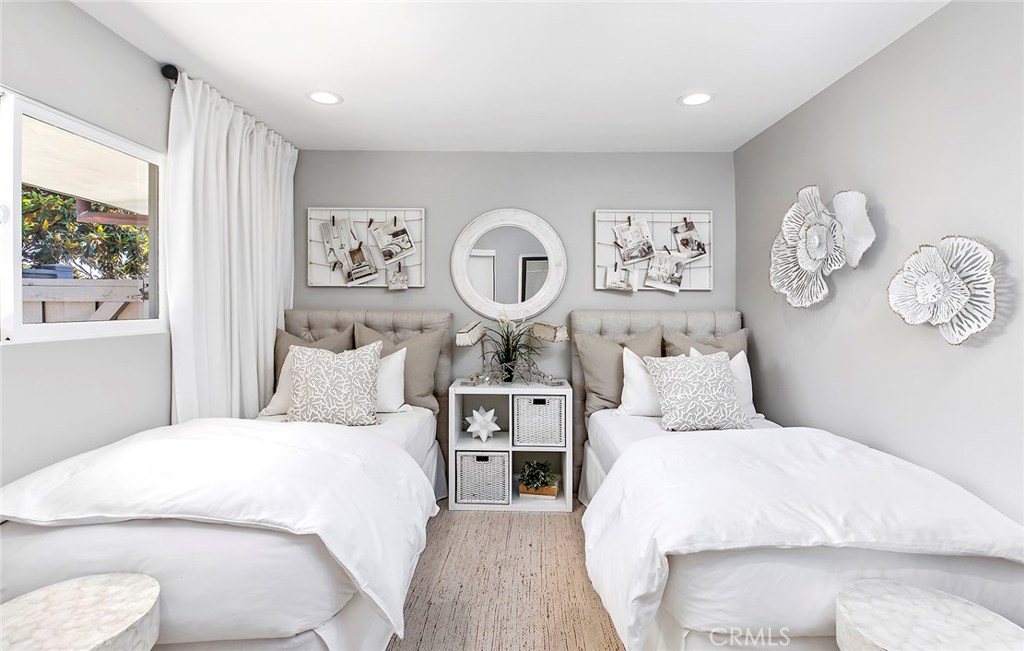 2526 Monaco Drive Laguna Beach, CA 92651 - Photo 35 of 59 a bedroom with a large bed and a window