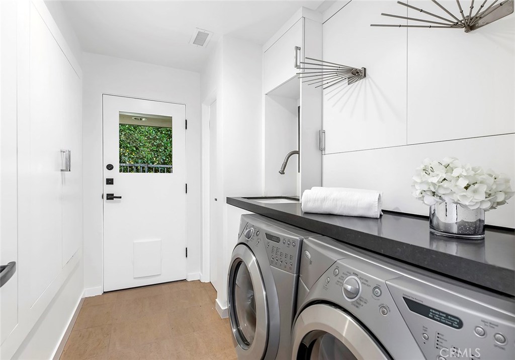 2526 Monaco Drive Laguna Beach, CA 92651 - Photo 37 of 59 a utility room with cabinets