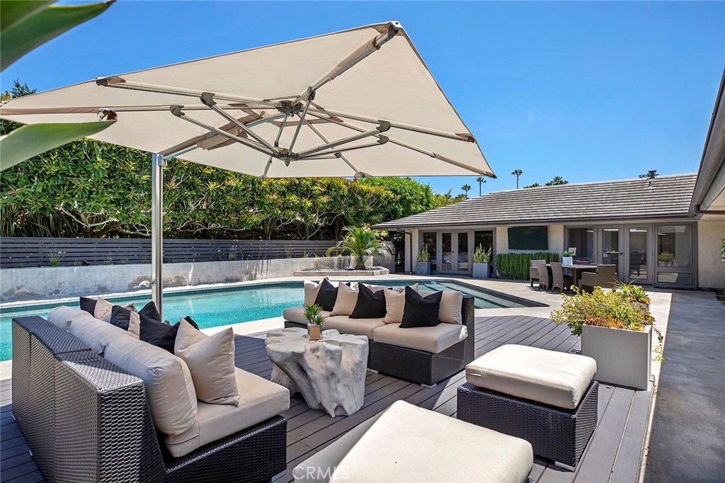 2526 Monaco Drive Laguna Beach, CA 92651 - Photo 42 of 59 a view of a patio with couches chairs under an umbrella