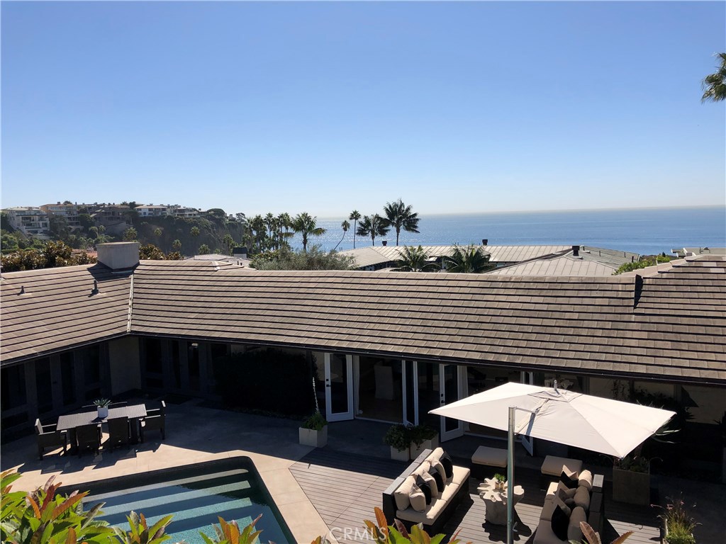 2526 Monaco Drive Laguna Beach, CA 92651 - Photo 46 of 59 a view of a patio with a table and chairs