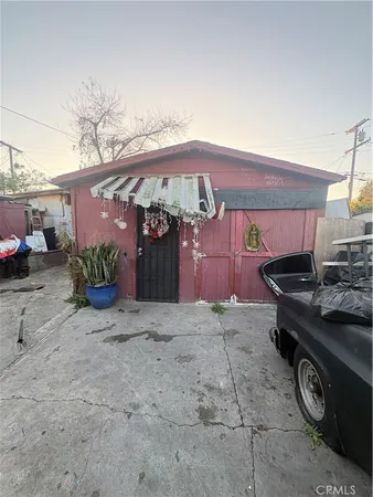 a front view of a house with parking space