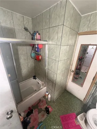 a bathroom with a bathtub and shower