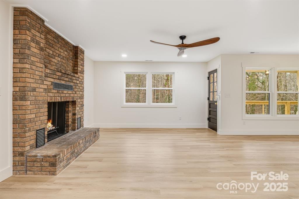 7 Angus Lane Asheville, NC 28805 - Photo 12 of 45 a view of an empty room with a window and fireplace