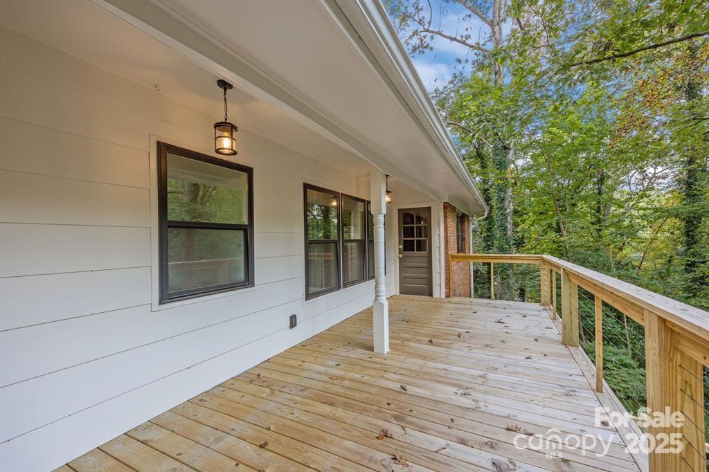 7 Angus Lane Asheville, NC 28805 - Photo 20 of 45 a view of house with wooden floor and windows