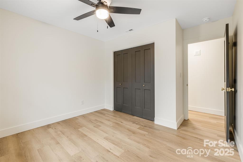 7 Angus Lane Asheville, NC 28805 - Photo 22 of 45 a view of empty room with wooden floor