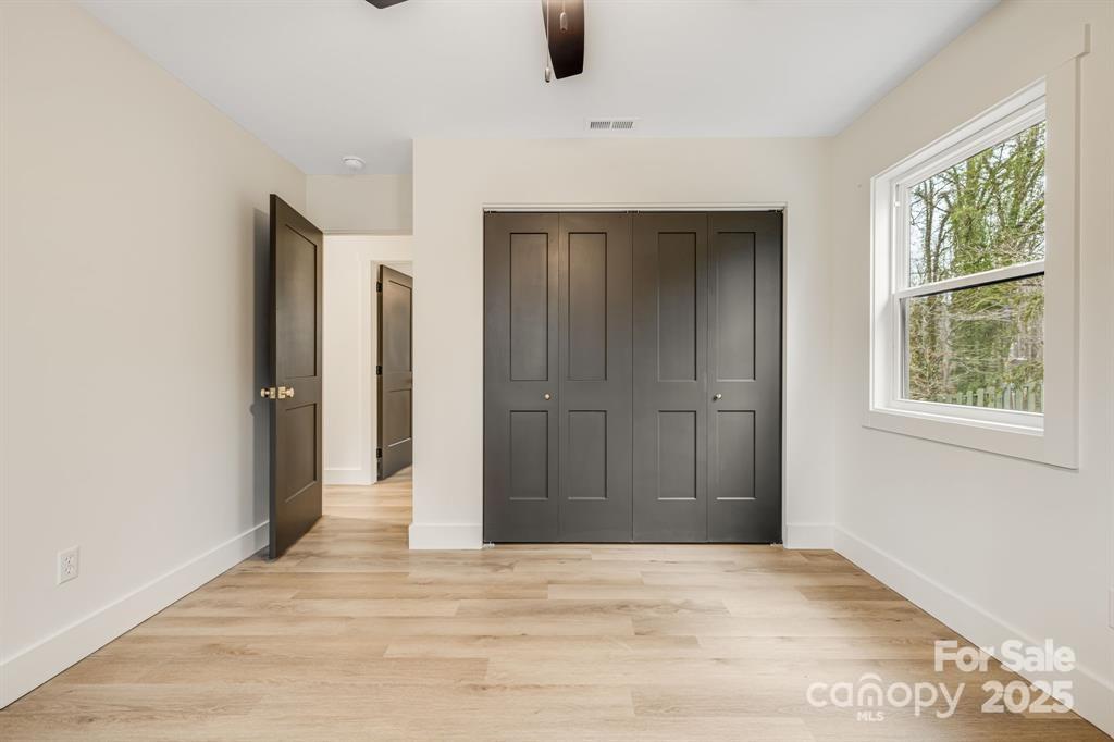 7 Angus Lane Asheville, NC 28805 - Photo 24 of 45 an empty room with windows and closet