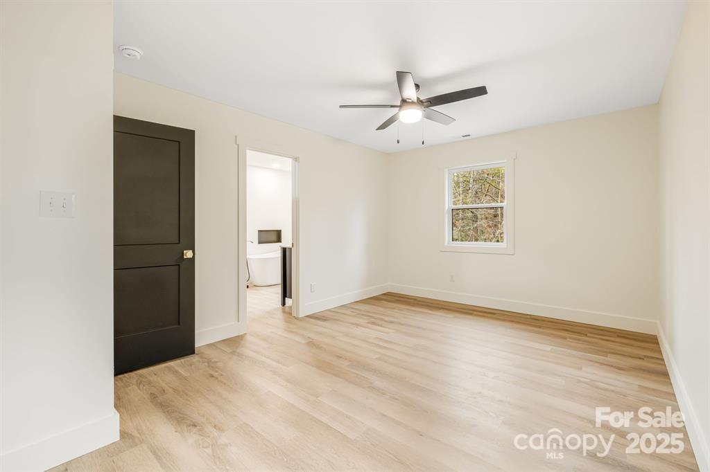 7 Angus Lane Asheville, NC 28805 - Photo 28 of 45 a view of empty room with wooden floor