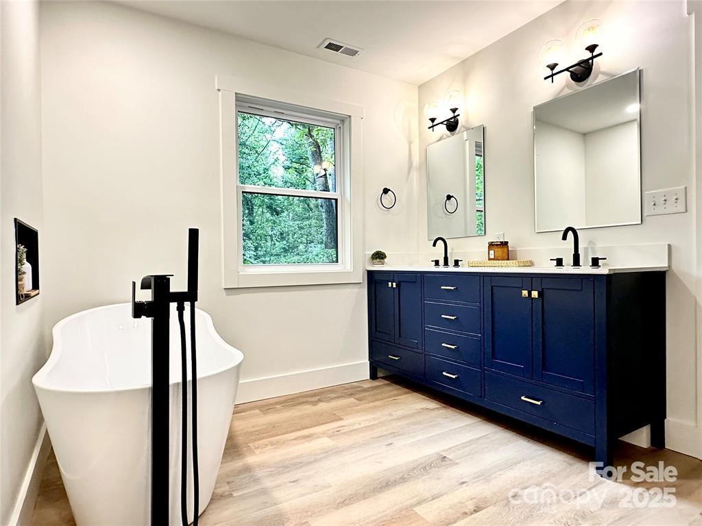 7 Angus Lane Asheville, NC 28805 - Photo 30 of 45 a bathroom with a sink double vanity and a mirror