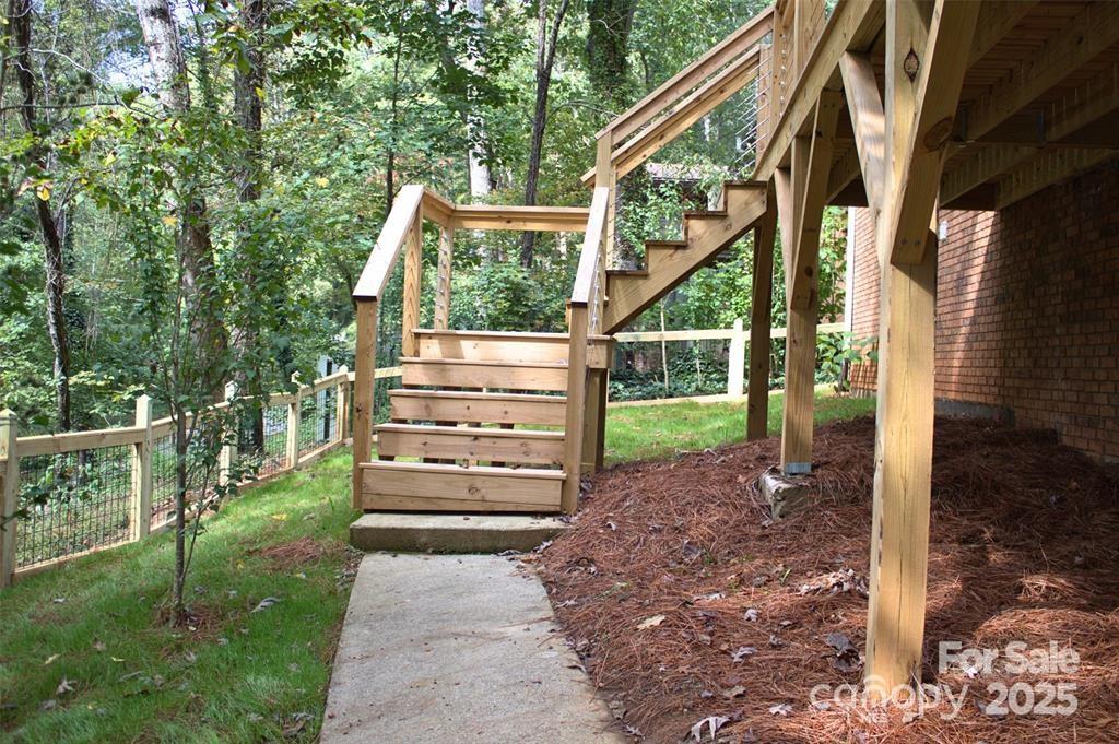 7 Angus Lane Asheville, NC 28805 - Photo 3 of 45 a view of a yard with plants and a garden