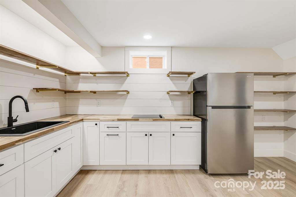 7 Angus Lane Asheville, NC 28805 - Photo 39 of 45 a kitchen with a refrigerator sink and cabinets