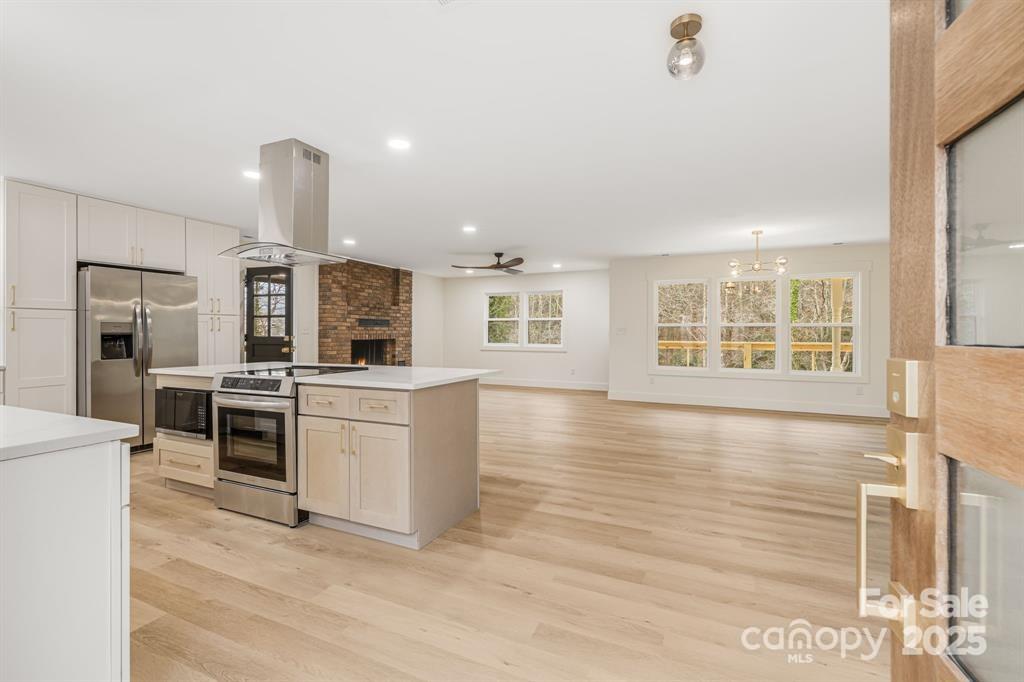 7 Angus Lane Asheville, NC 28805 - Photo 7 of 45 a kitchen with stainless steel appliances granite countertop a stove and a sink