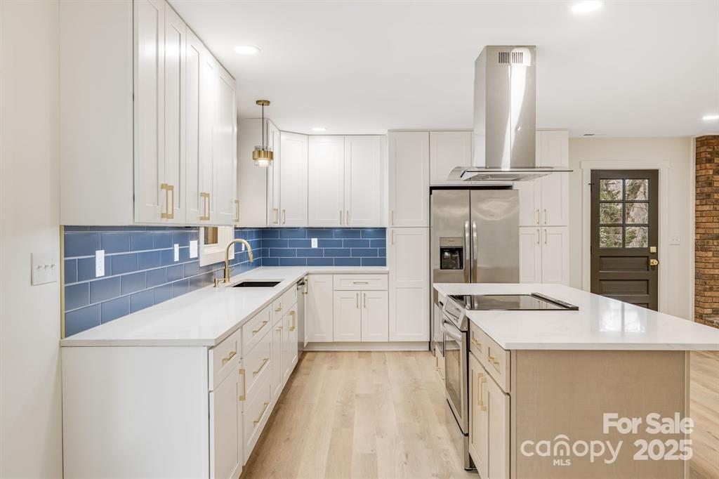 7 Angus Lane Asheville, NC 28805 - Photo 8 of 45 a kitchen with a sink stove and cabinets