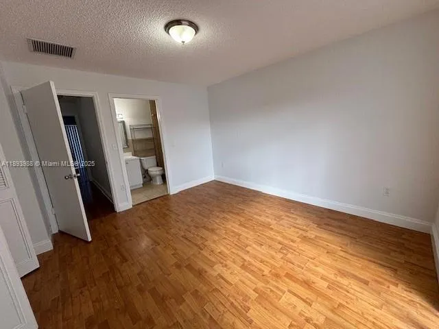 a bathroom with a shower a sink a toilet and shower