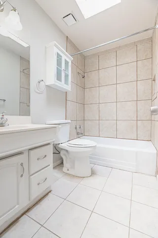 a bathroom with a bathtub sink and toilet