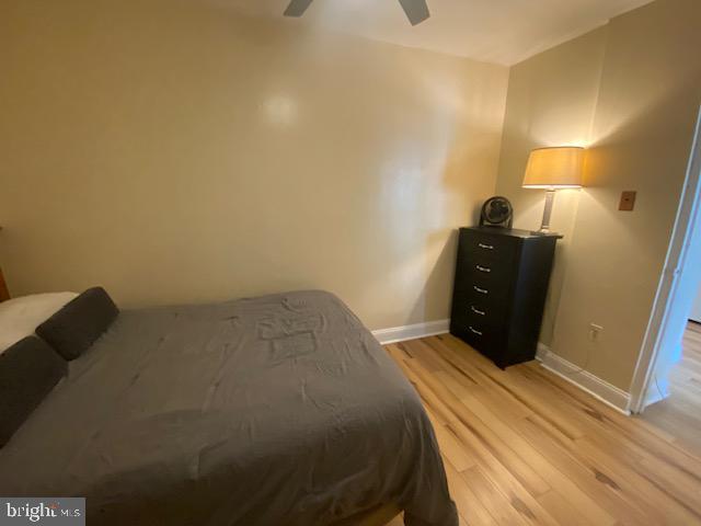 1121 Arlington Boulevard, Unit 325 Arlington, VA 22209 - Photo 14 of 39 a bed sitting in a bedroom next to a lamp