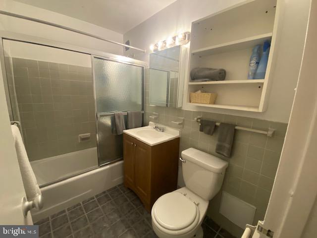 1121 Arlington Boulevard, Unit 325 Arlington, VA 22209 - Photo 17 of 39 a bathroom with a toilet a sink and shower