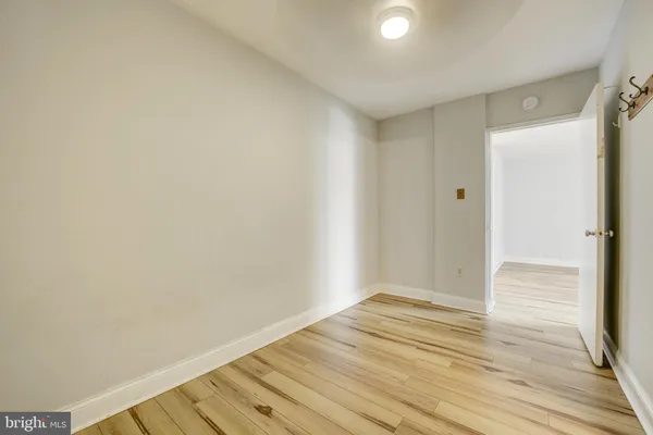 a view of room with wooden floor