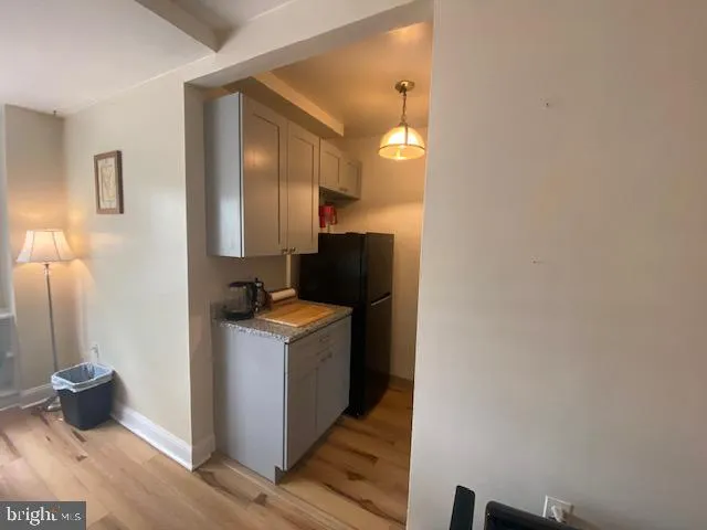 a kitchen with a stove and a refrigerator