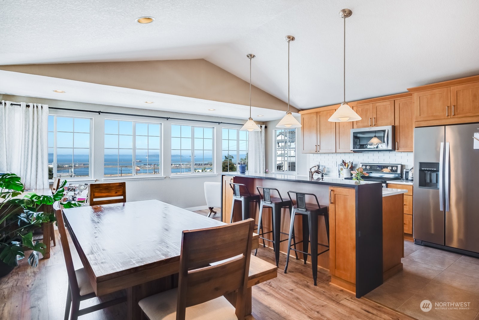 2605 Rucker Avenue, Unit 301 Everett, WA 98201 - Photo 1 of 29 a view of a dining room with furniture window and wooden floor