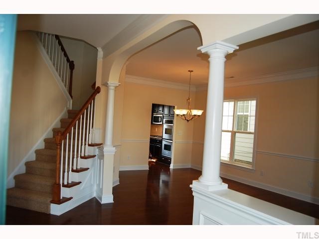 1208 Chapanoke Road Raleigh, NC 27603 - Photo 7 of 12 a view of entryway with stairs and wooden floor