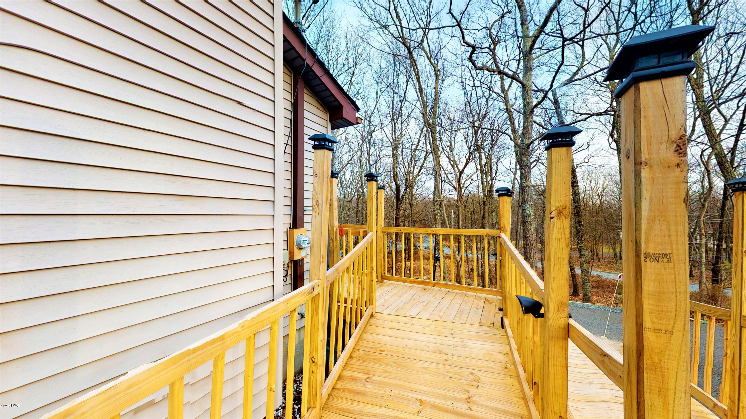 130 Maple Ridge Road Milford, PA 18337 - Photo 13 of 44 a view of balcony with stairs and wooden floor