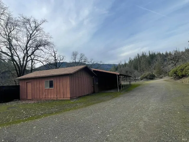 a fire hydrant is sitting in the middle of a field