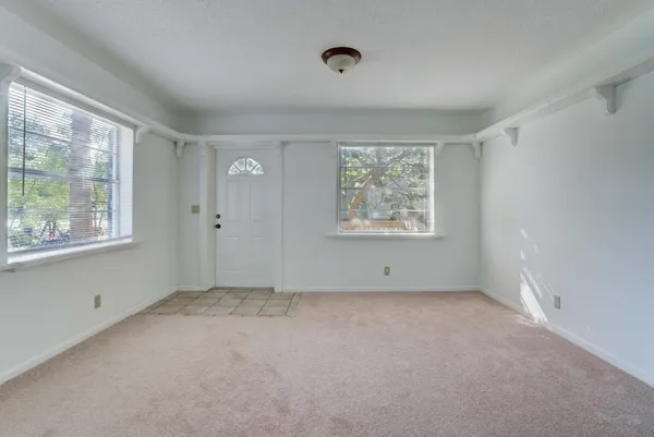 a view of an empty room with a window