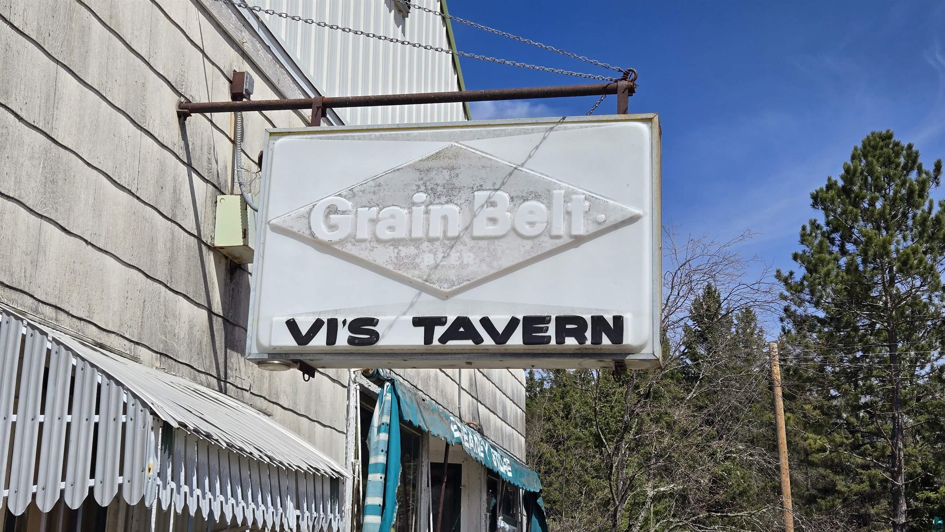3293 South Greaney Road Orr, MN 55771 - Photo 7 of 17 Commercial signage featuring a white illuminated box sign with black lettering