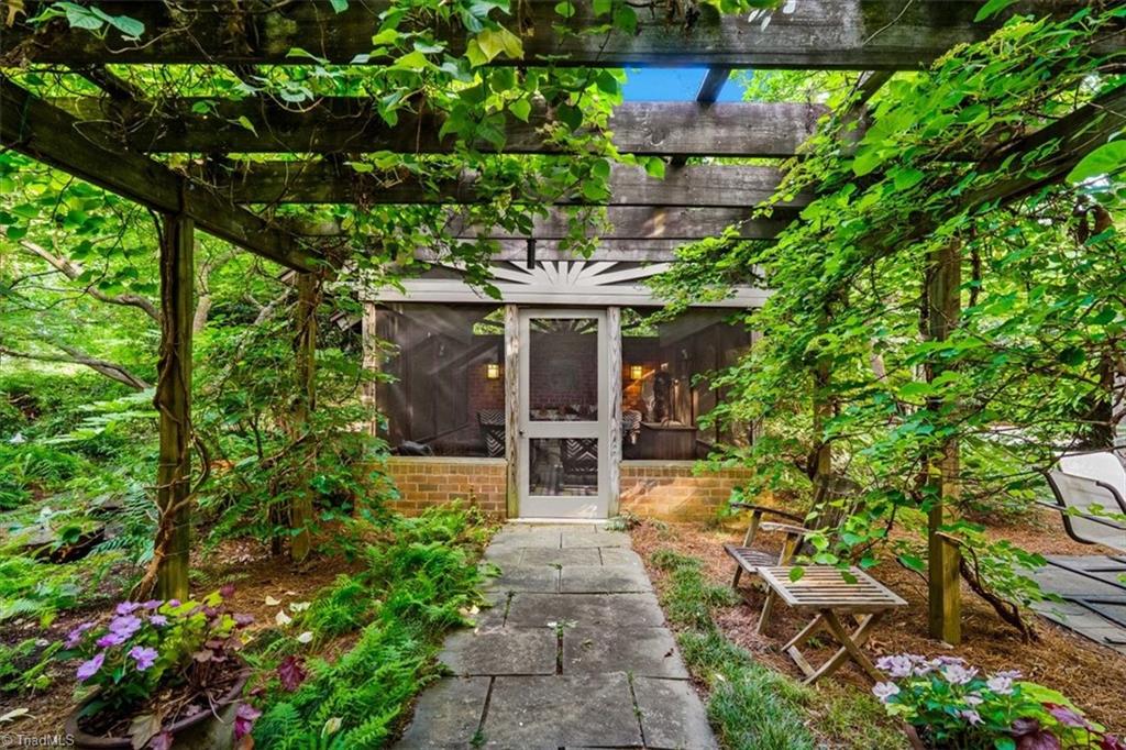 1905 Huntington Road Greensboro, NC 27408 - Photo 39 of 47 Walkway to Screened Porch
