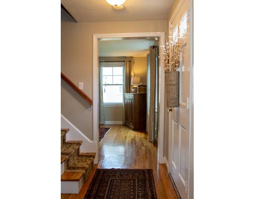 36 Buick Street Springfield, MA 01118 - Photo 8 of 30 a view of a hallway with wooden floor and a living room