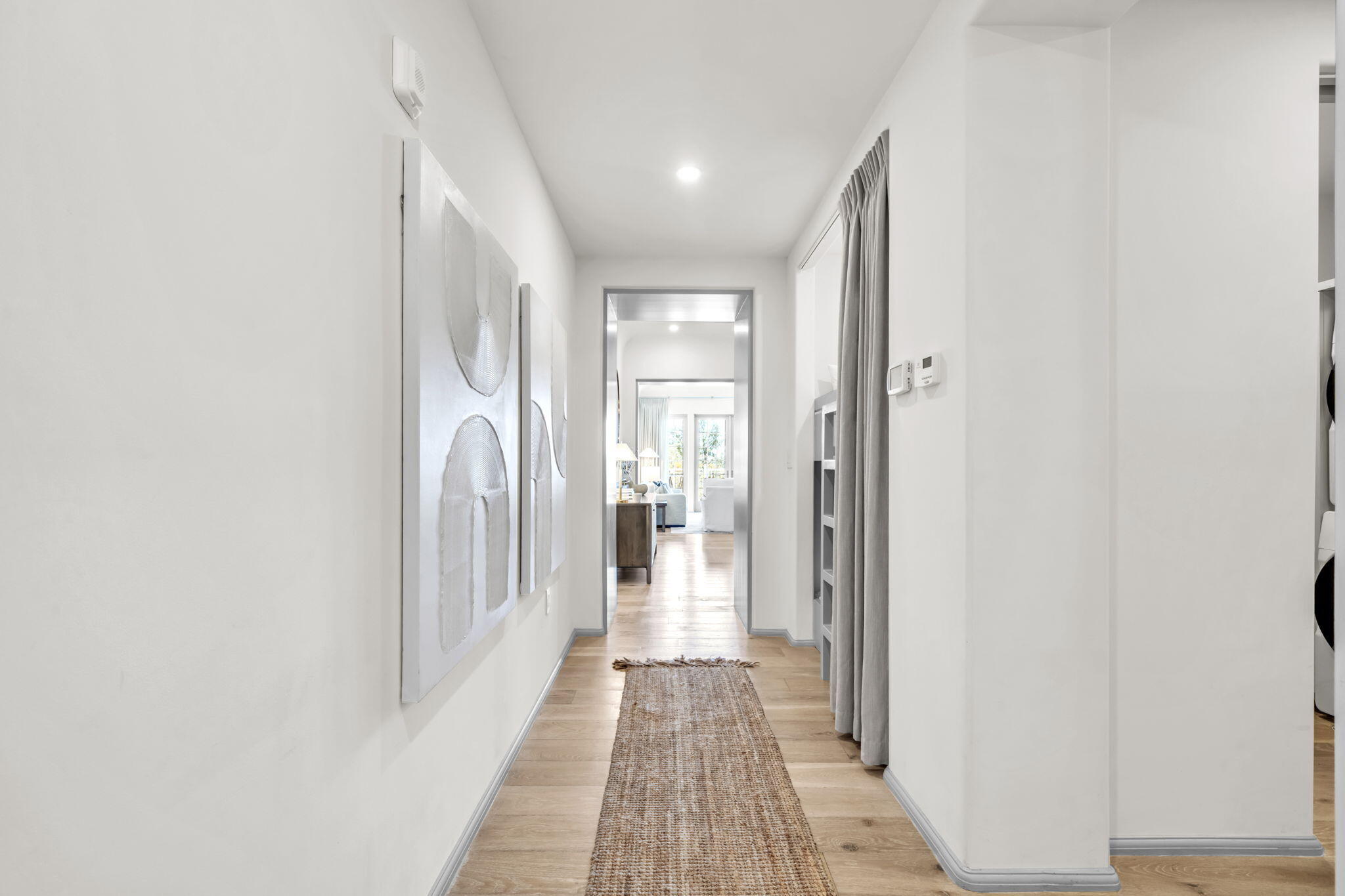 45 West Solaire Way Inlet Beach, Unit 207 Inlet Beach, FL 32461 - Photo 11 of 55 a view of a hallway with wooden floor and a bathroom