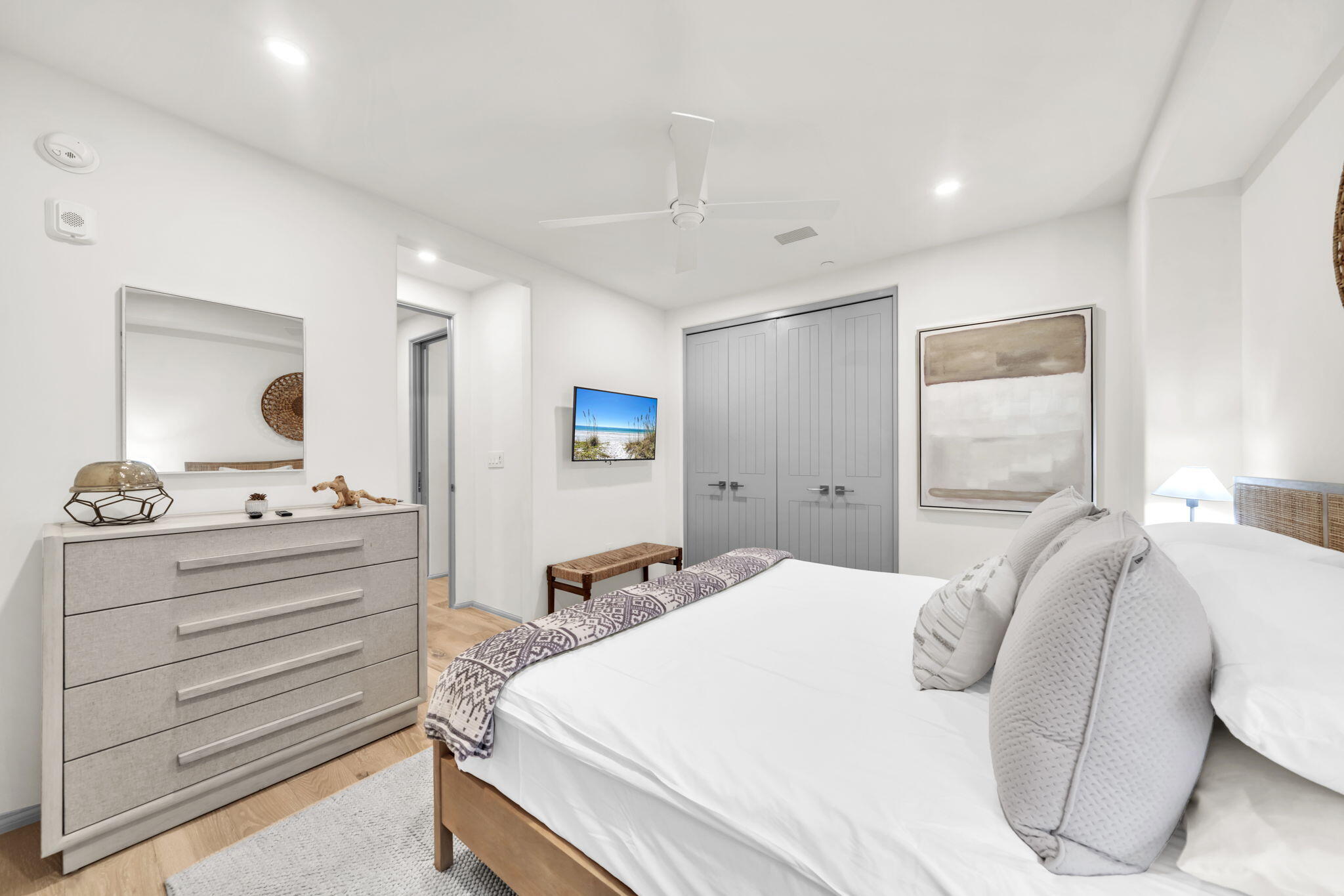 45 West Solaire Way Inlet Beach, Unit 207 Inlet Beach, FL 32461 - Photo 17 of 55 a bedroom with a bed and a dresser