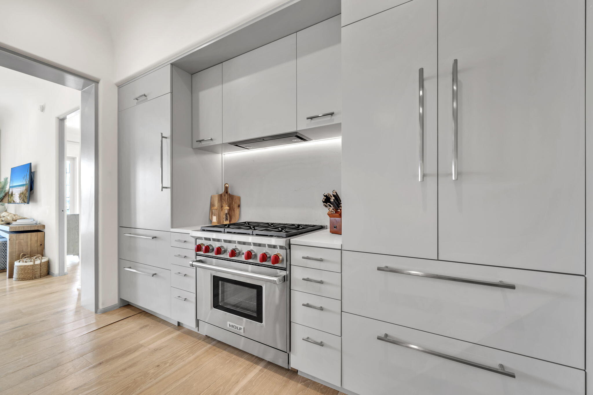 45 West Solaire Way Inlet Beach, Unit 207 Inlet Beach, FL 32461 - Photo 21 of 55 a kitchen with stove top oven and refrigerator