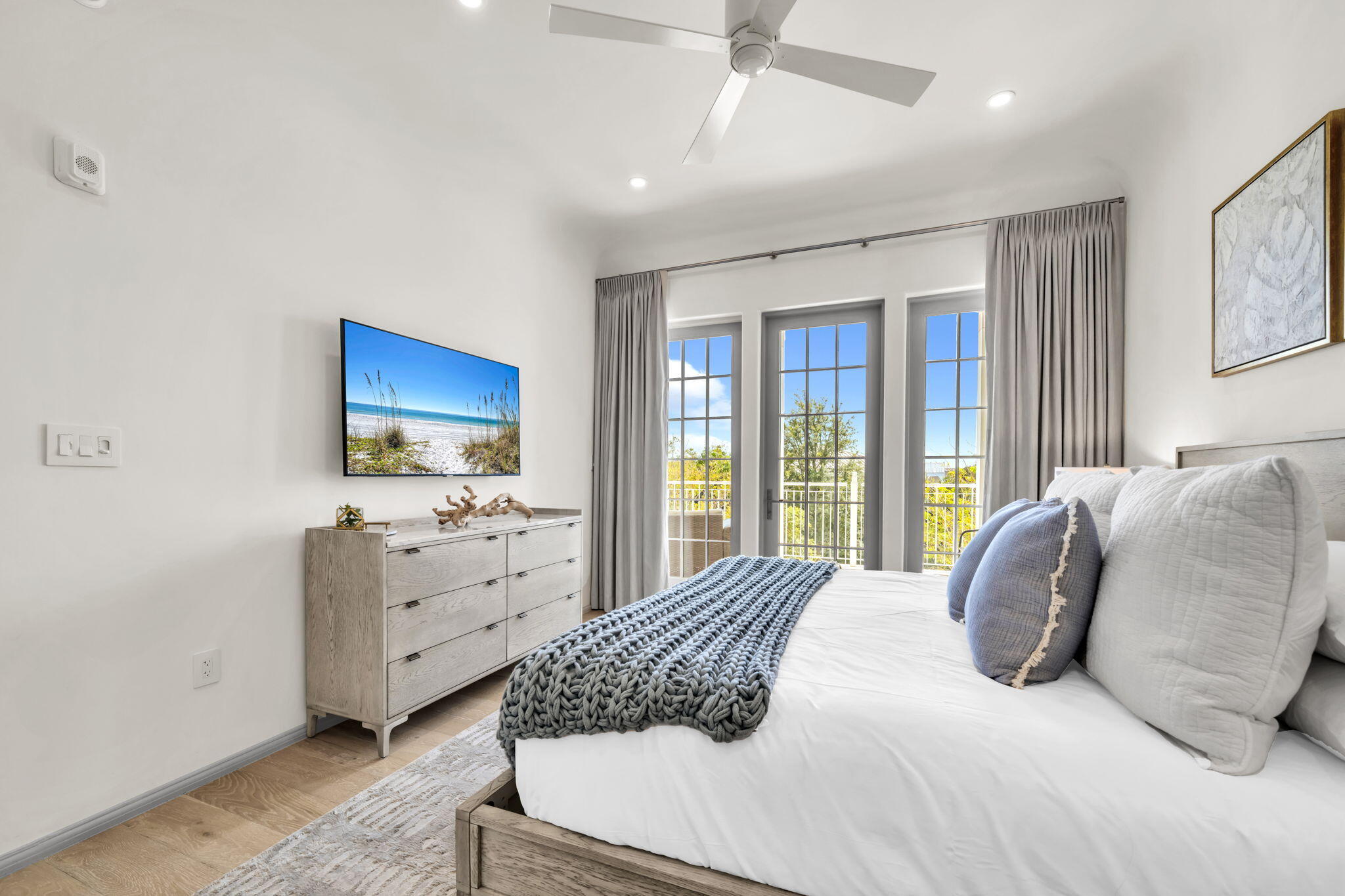 45 West Solaire Way Inlet Beach, Unit 207 Inlet Beach, FL 32461 - Photo 27 of 55 a bedroom with a large bed and a flat screen tv