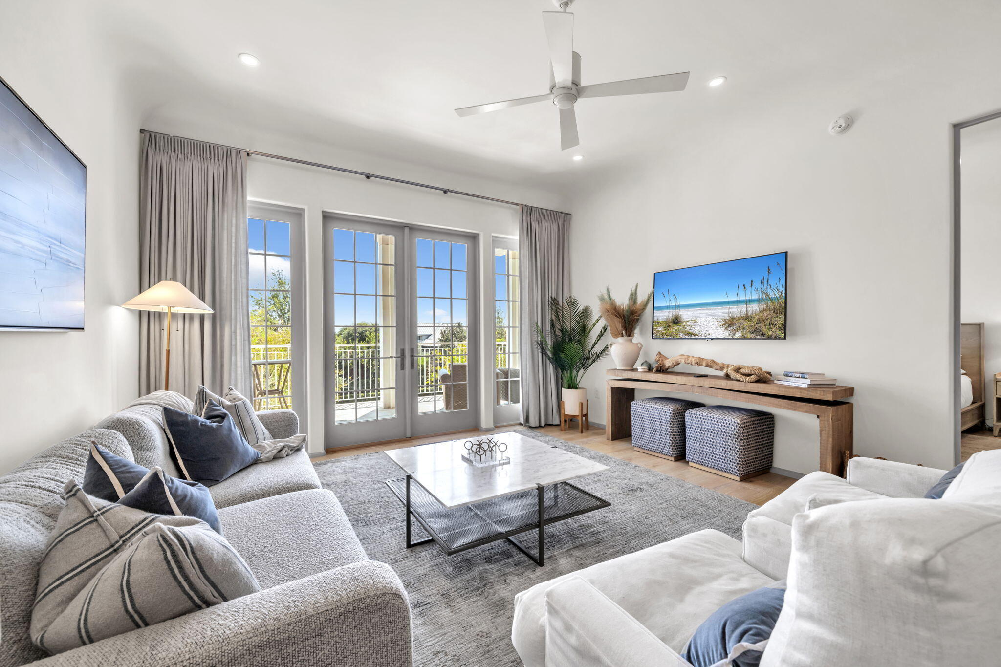 45 West Solaire Way Inlet Beach, Unit 207 Inlet Beach, FL 32461 - Photo 3 of 55 a living room with furniture ceiling fan and a rug