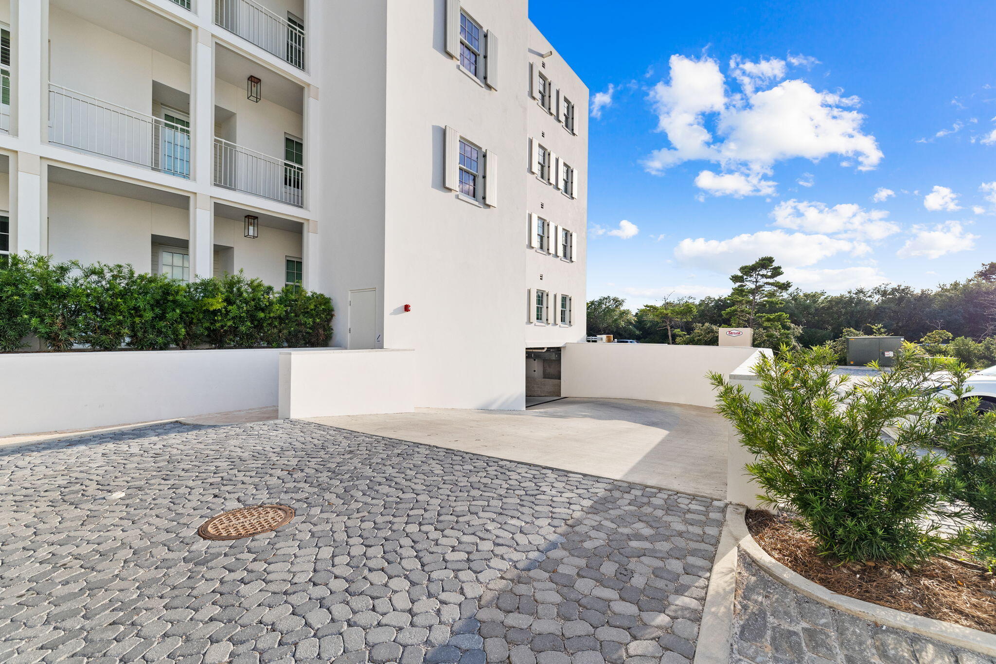 45 West Solaire Way Inlet Beach, Unit 207 Inlet Beach, FL 32461 - Photo 38 of 55 a view of a white building with a yard