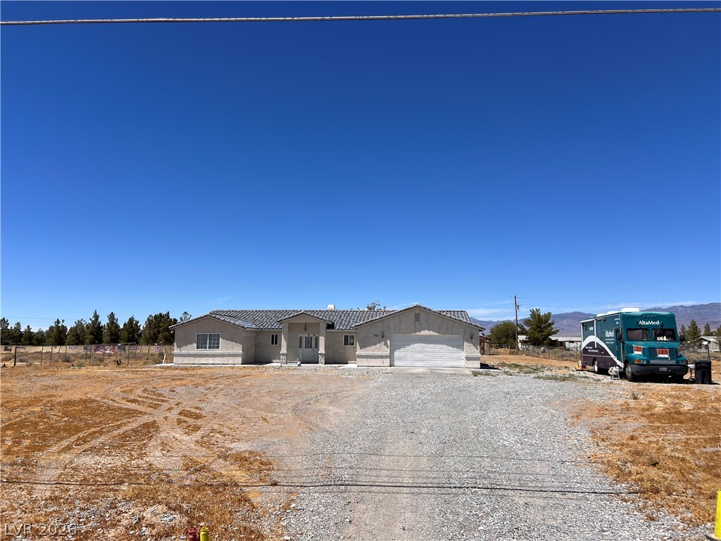 200 East Gamebird Road Pahrump, NV 89048 - Photo 1 of 23 A sprawling single-story residence awaits on a generous, undeveloped lot.
