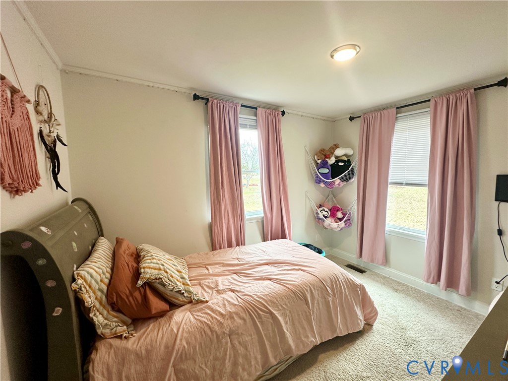 7406 Stubbs Bridge Road Spotsylvania, VA 22551 - Photo 12 of 13 a bedroom with a bed and a window