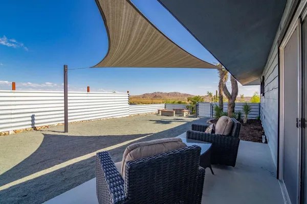 a view of balcony with furniture