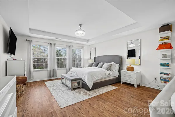a spacious bathroom with a tub sink shower and mirror