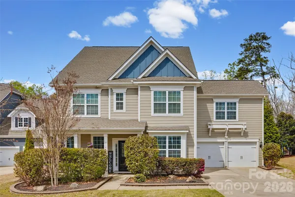 a kitchen with granite countertop a stove a sink and a microwave