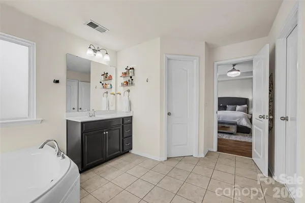 a bathroom with a double vanity sink mirror and vanity