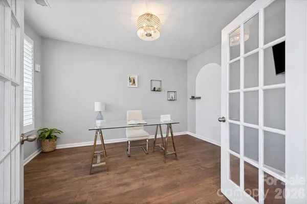 a large white kitchen with stainless steel appliances