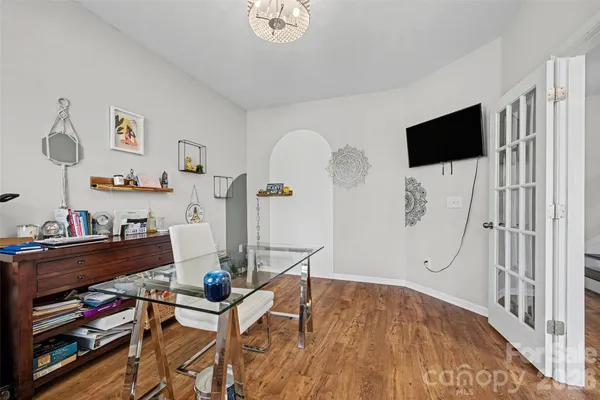 a view of a dining room with furniture and chandelier