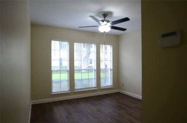 a view of wooden floor and a chandelier in a room
